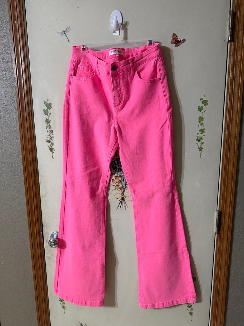 Risen High-Rise Flared Jeans in Hot Pink